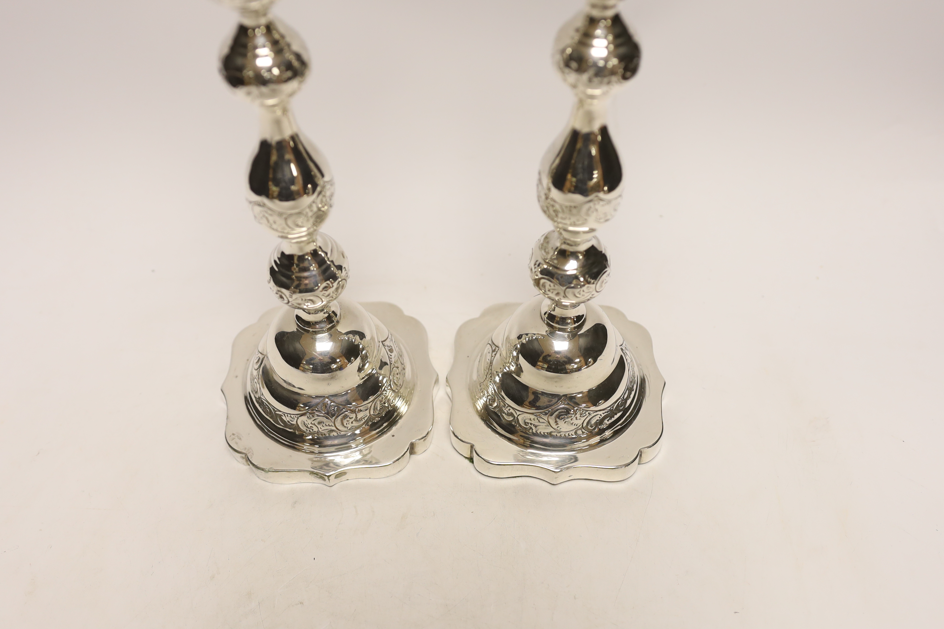 A pair of George V silver Sabbath candlesticks, by Rosenzweig, Taitelbaum & Co, London, circa 1925, marks rubbed, height 29.4cm, weighted.